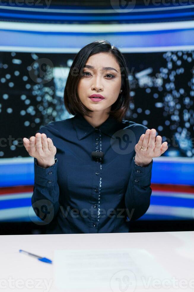 Broadcaster hosting night show live on television channel, discussing about latest celebrity scandals and global trends. Woman newscaster delivering breaking news headlines on tv program. photo