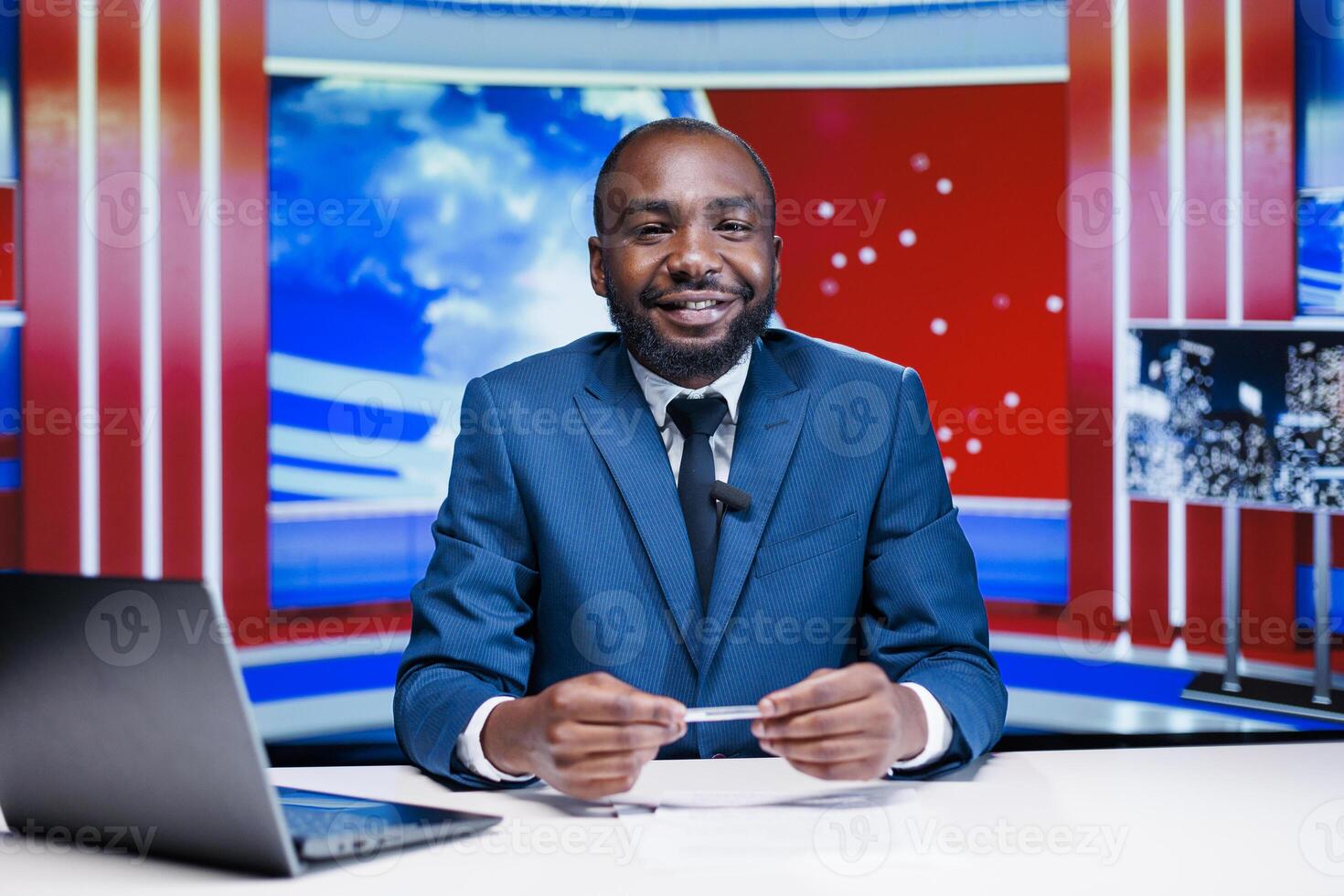 News anchor sharing breaking news in media studio, discussing about international events and reading headlines live. African american newscaster reporting information to create influential story. photo