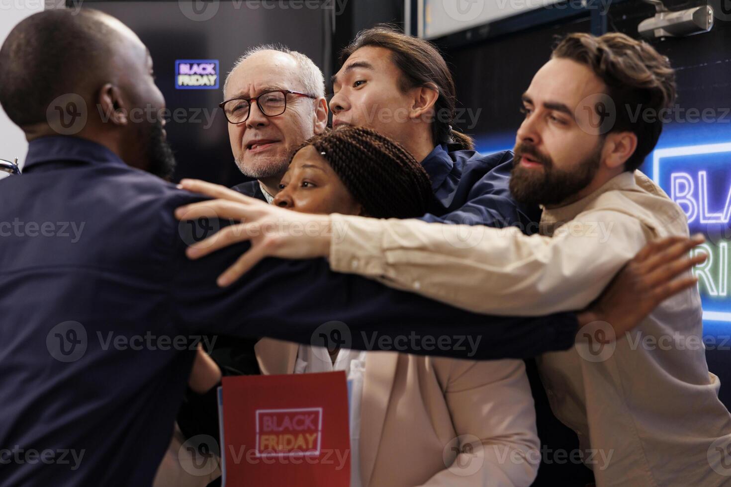 Black Friday madness. African American security guard holding back angry enger crowd while controlling store entrance, diverse people shoppers breaking into retail shop during seasonal sales photo
