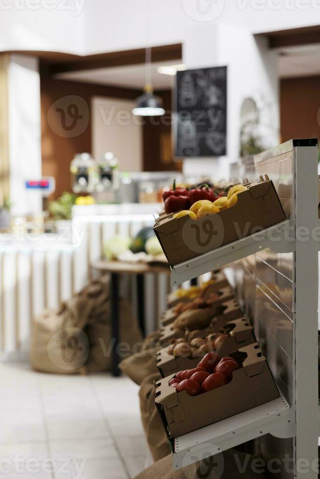 Local sourced groceries on shelves in zero waste supermarket. Bio and nutritious vegetables grown organically ready to be sold to healthy living customers in eco food shop photo