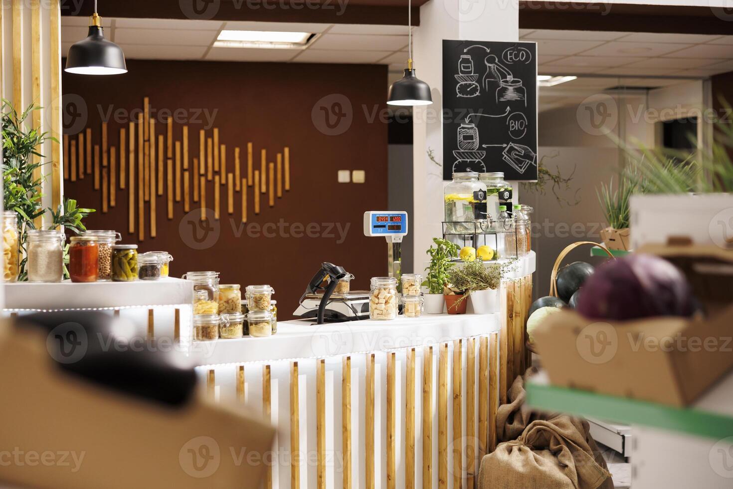 Products sold in bulk in zero waste store to minimize plastic usage, creating positive environmental impact. Ethically sourced pantry staples ready to be bought by consciously living customers photo