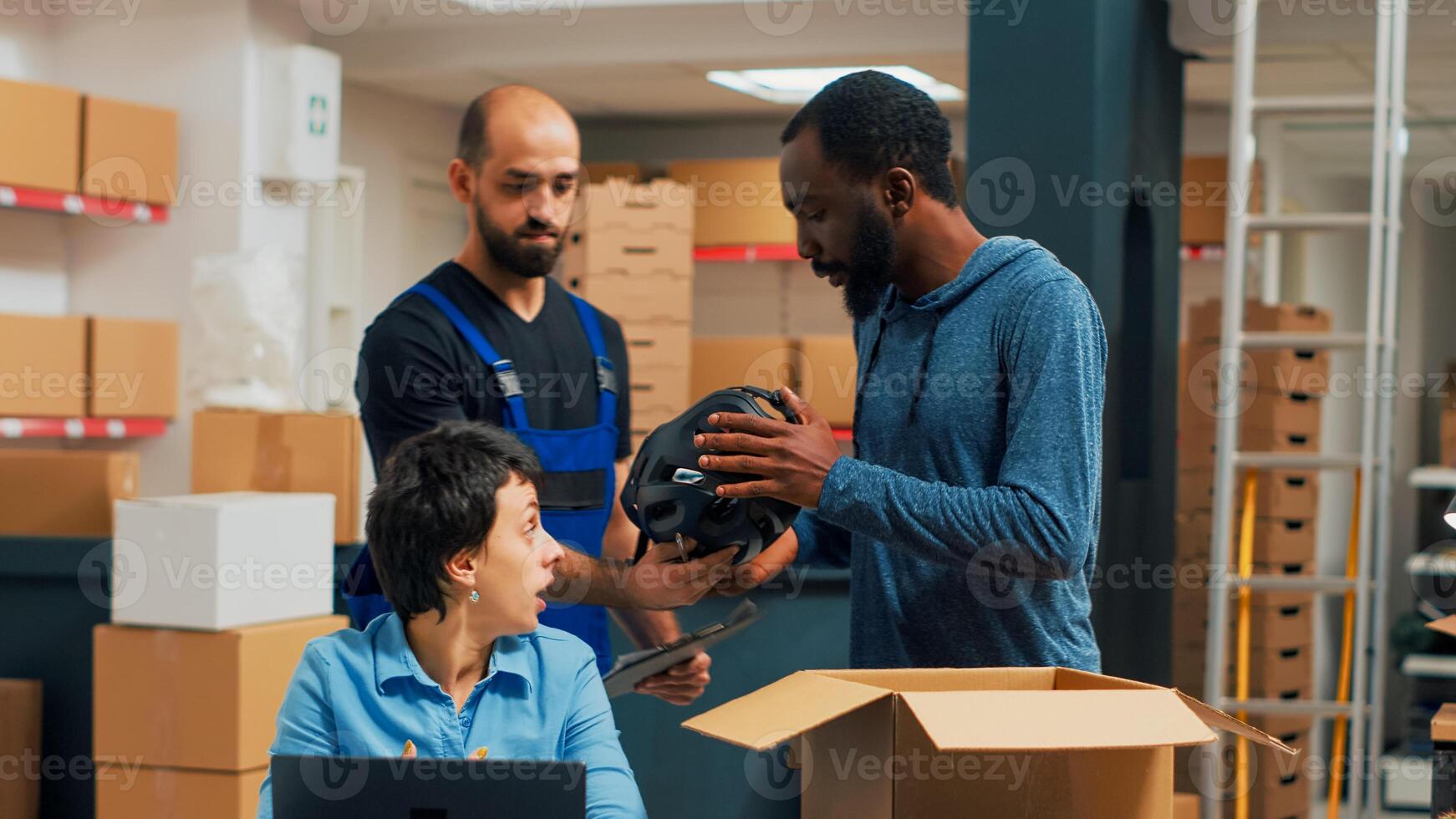 Small business owners doing quality control before shipping order to customers, looking at products in boxes. Three people working in warehouse and packing merchandise, shipment. photo