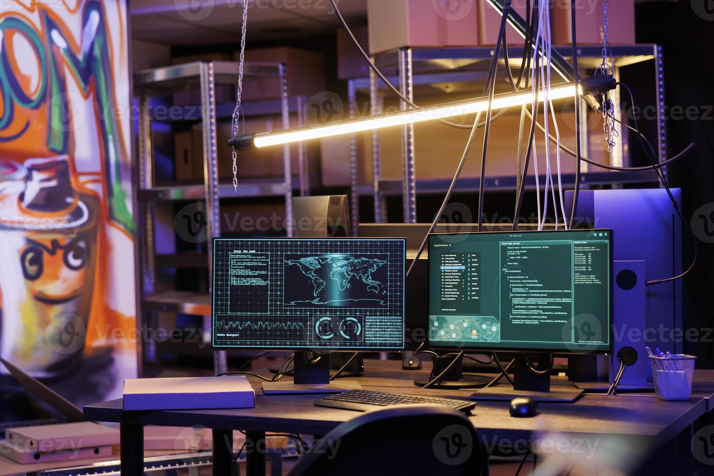 Computer screens displaying data and ransomware code at hackers workspace. Malicious software cracking password on monitors in abandoned warehouse with graffiti and neon light photo