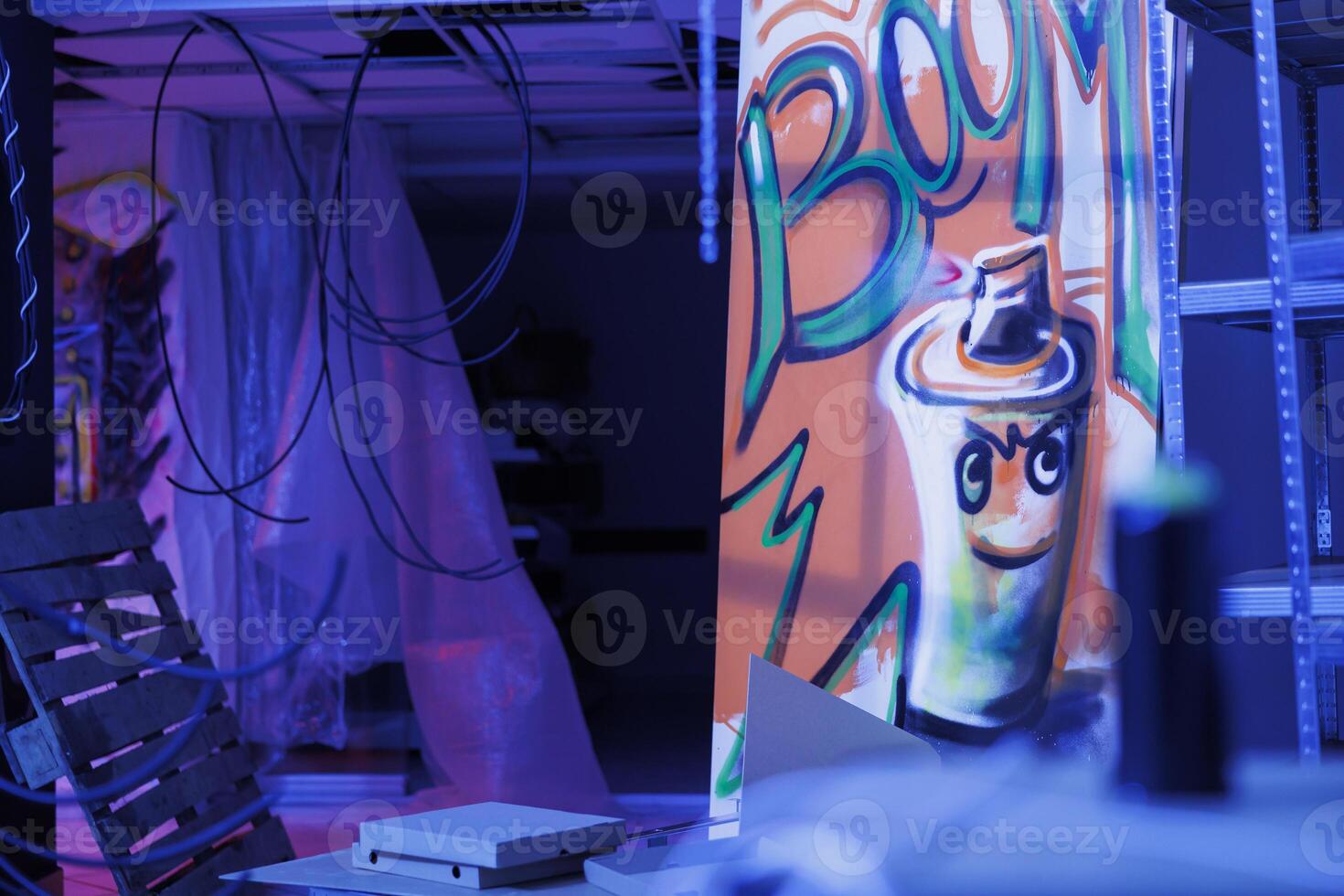 Broken down space glowing with fluorescent lights, urban ghetto building with spray paint art and purple glow. Empty old abandoned warehouse being illuminated by bright neon lights. photo