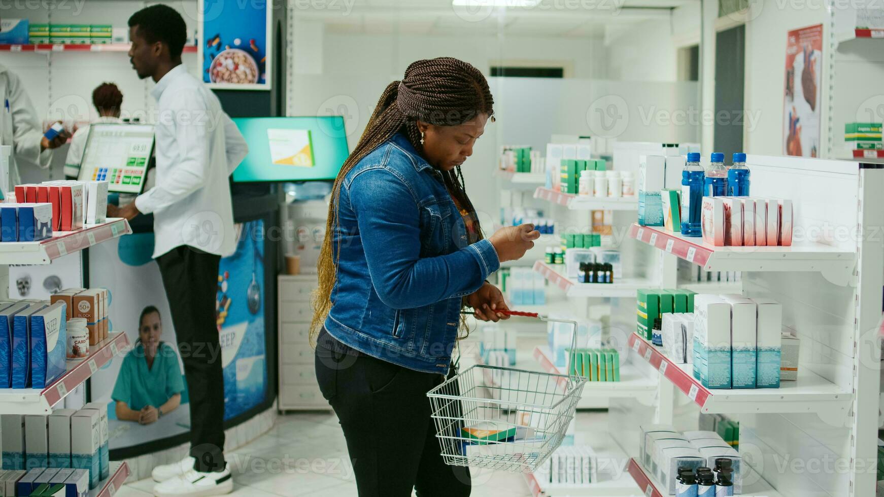 Young person checking boxes of pills from drugstore shelves, looking to buy healthcare products from retail store. Female client taking medicine and supplements from pharmacy. photo