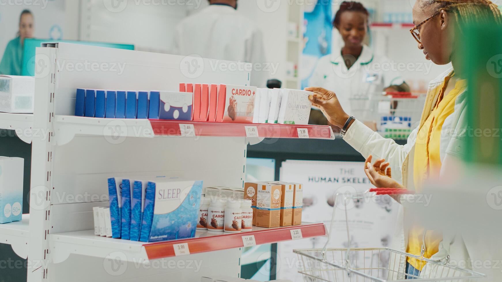 African american client looking at drugs on shelves, buying medicaments and healthcare products from drugstore. Young customer taking pills or vitamins from racks. Handheld shot. photo