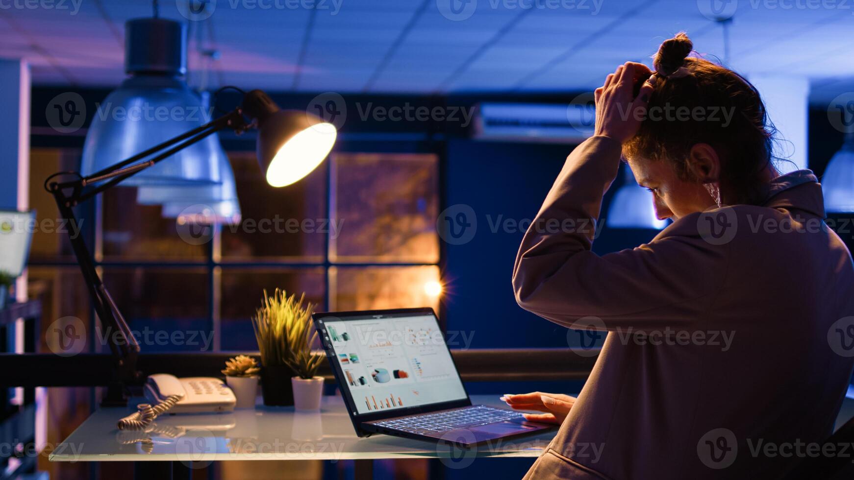 Caucasian manager working with financial diagrams, analyzing report with economy graphs in company office. Professional advisor planning business investment to increase profit. Handheld shot. photo