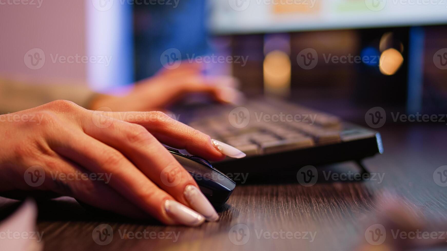 Company employee working on computer at night and typing data to create financial graphs report. Manager planning development with statistics and new investment for profit. Tripod shot. Close up. photo