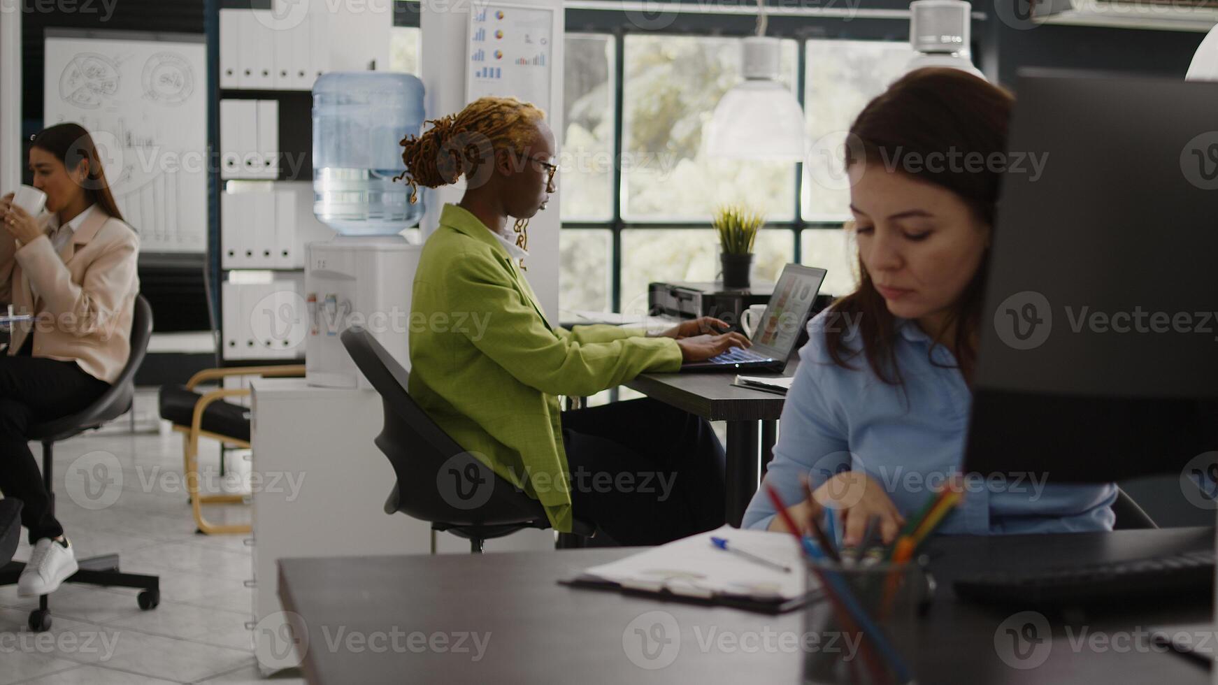 Office employee reading annual data report on screen, checking analytics before planning new company investment at desk. Young woman analyzing internet statistics, profit growth. photo