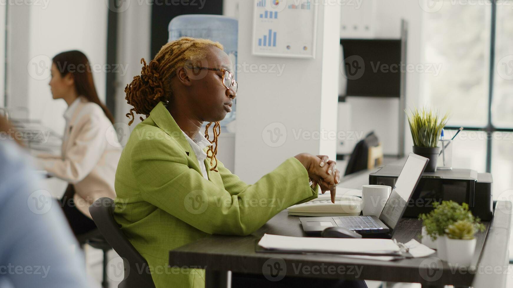 Agency entrepreneur thinking about growth solution to increase company profit at workplace. Young assistant brainstorming new ideas to create executive report for business development. photo