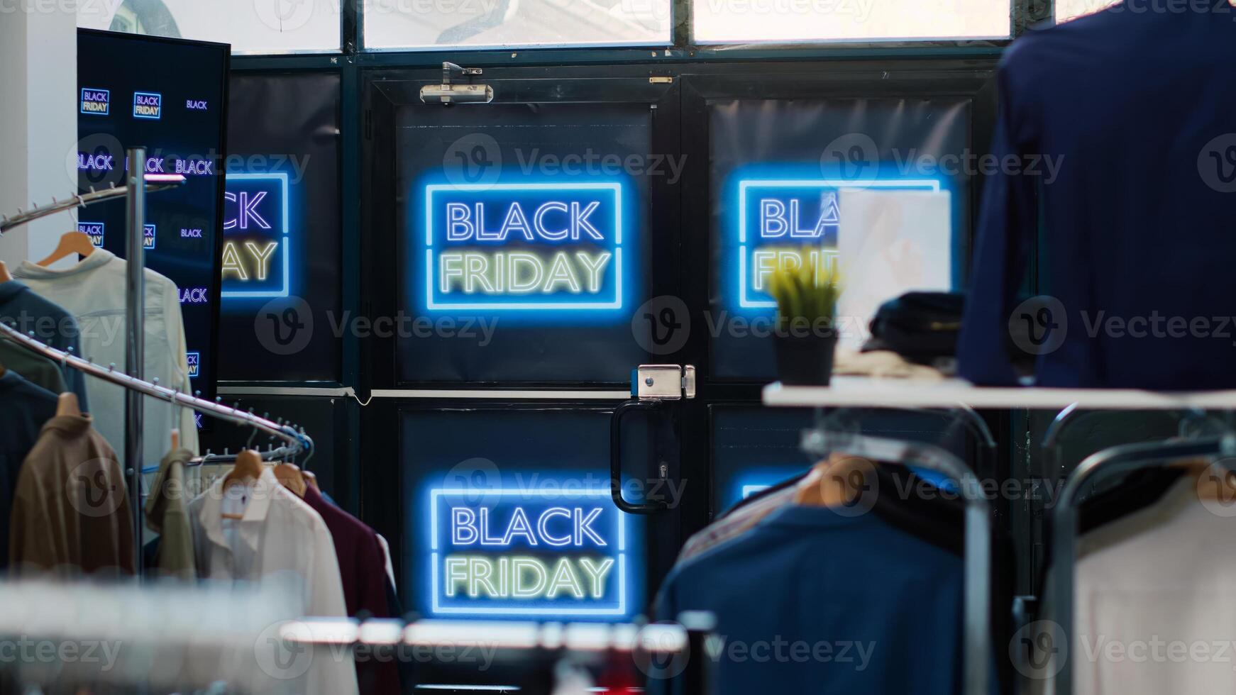 Black friday retail store with offers, november seasonal sales in shopping center. Clothes at small prices in fashion boutique, neon banners with special promo to attract customers. photo