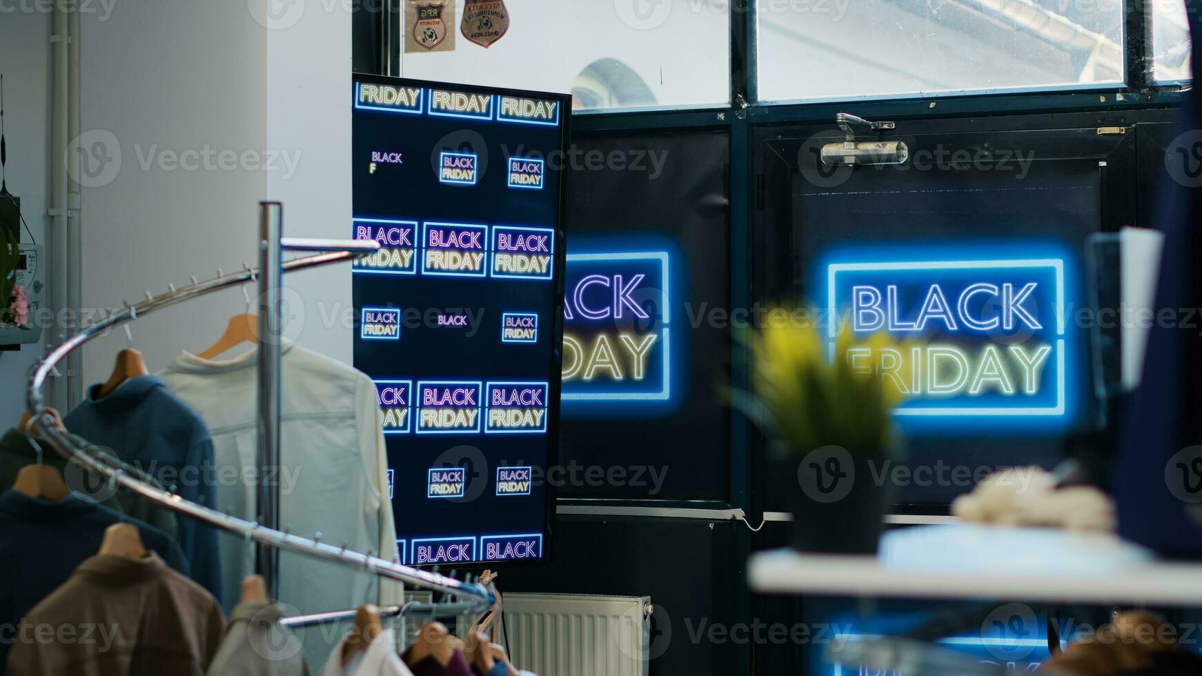 Black friday promotion shopping day inside retail store at mall, front door decorated with promotional banners and discount flyers. Attract potential customers during november sales. photo