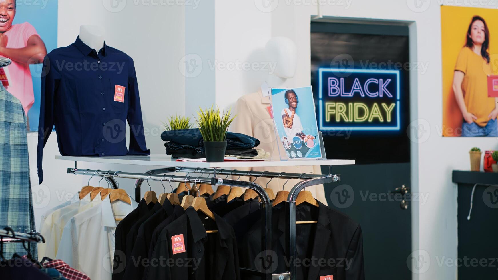 Promotional sales advertisement in store, price tags on clearance items indicating discounts. Attract clients during black friday event at shopping center, banners at front door. photo