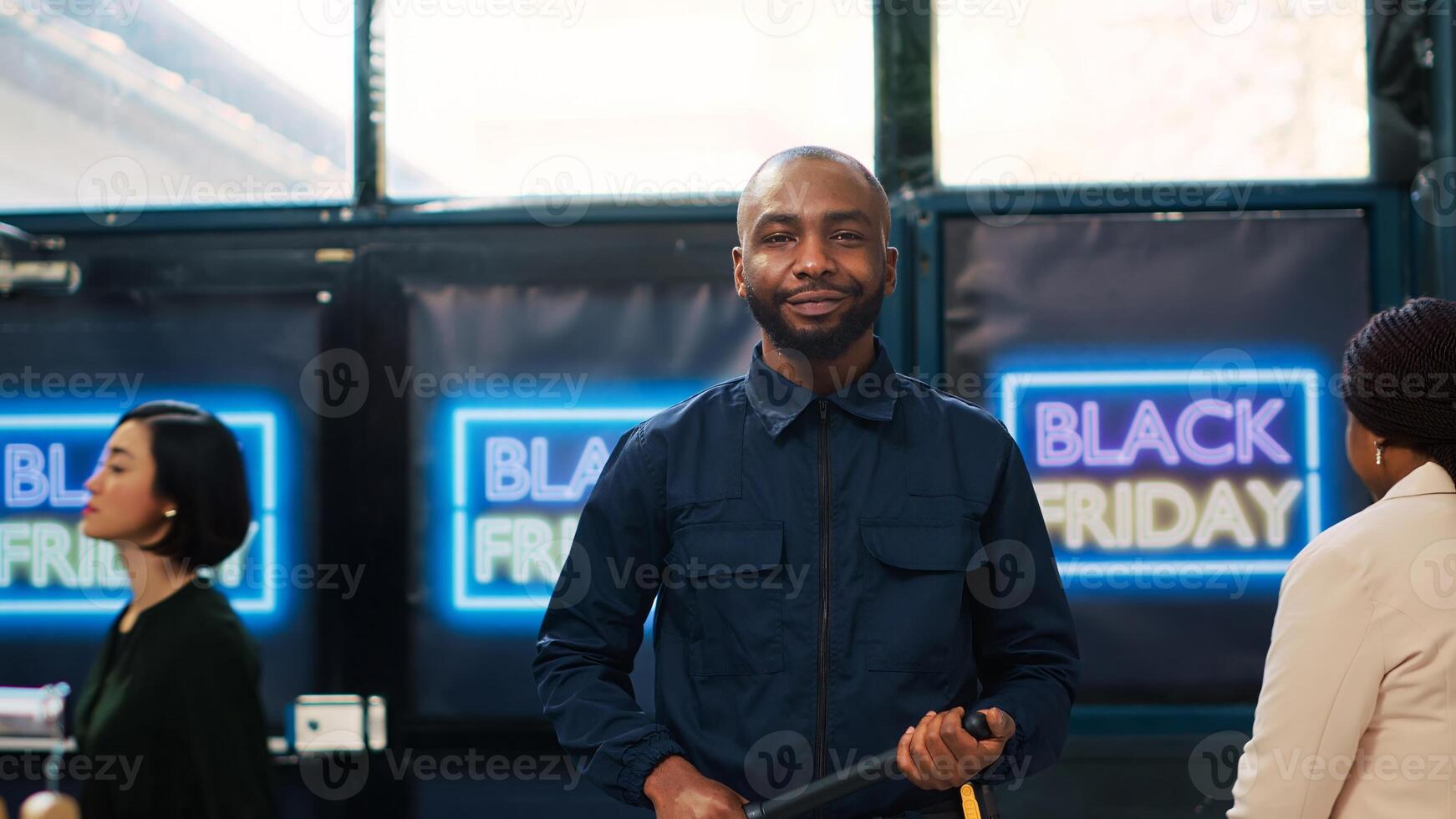 Patrol agent in shopping center with uniform and equipment, working to ensure safety. Security guard on black friday promotional event, ready to use baton and protecting customers. photo