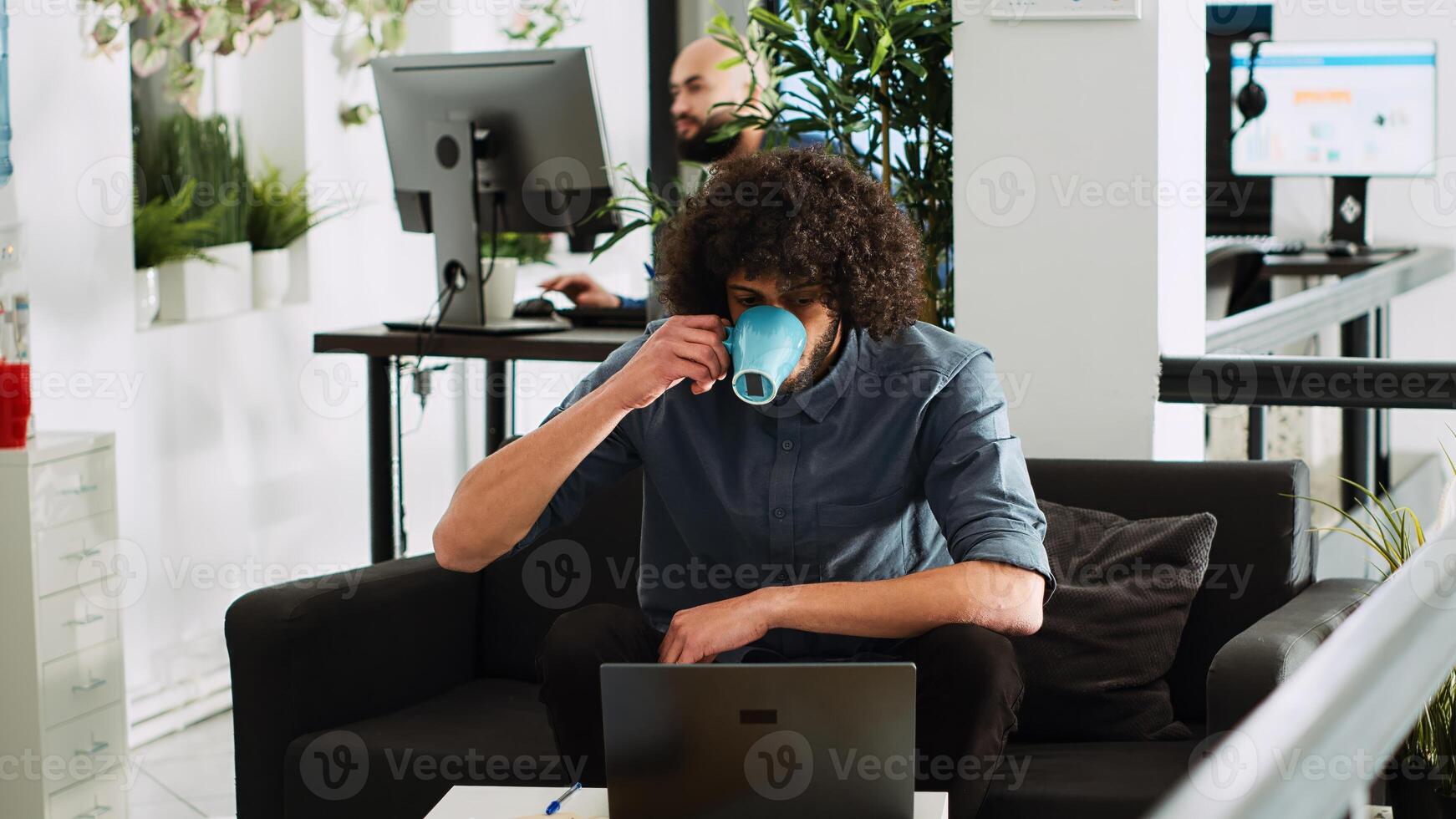 Startup manager making presentation on laptop in business coworking space. Middle eastern entrepreneur checking data statistics to create financial report and solve new task. Tripod shot. photo