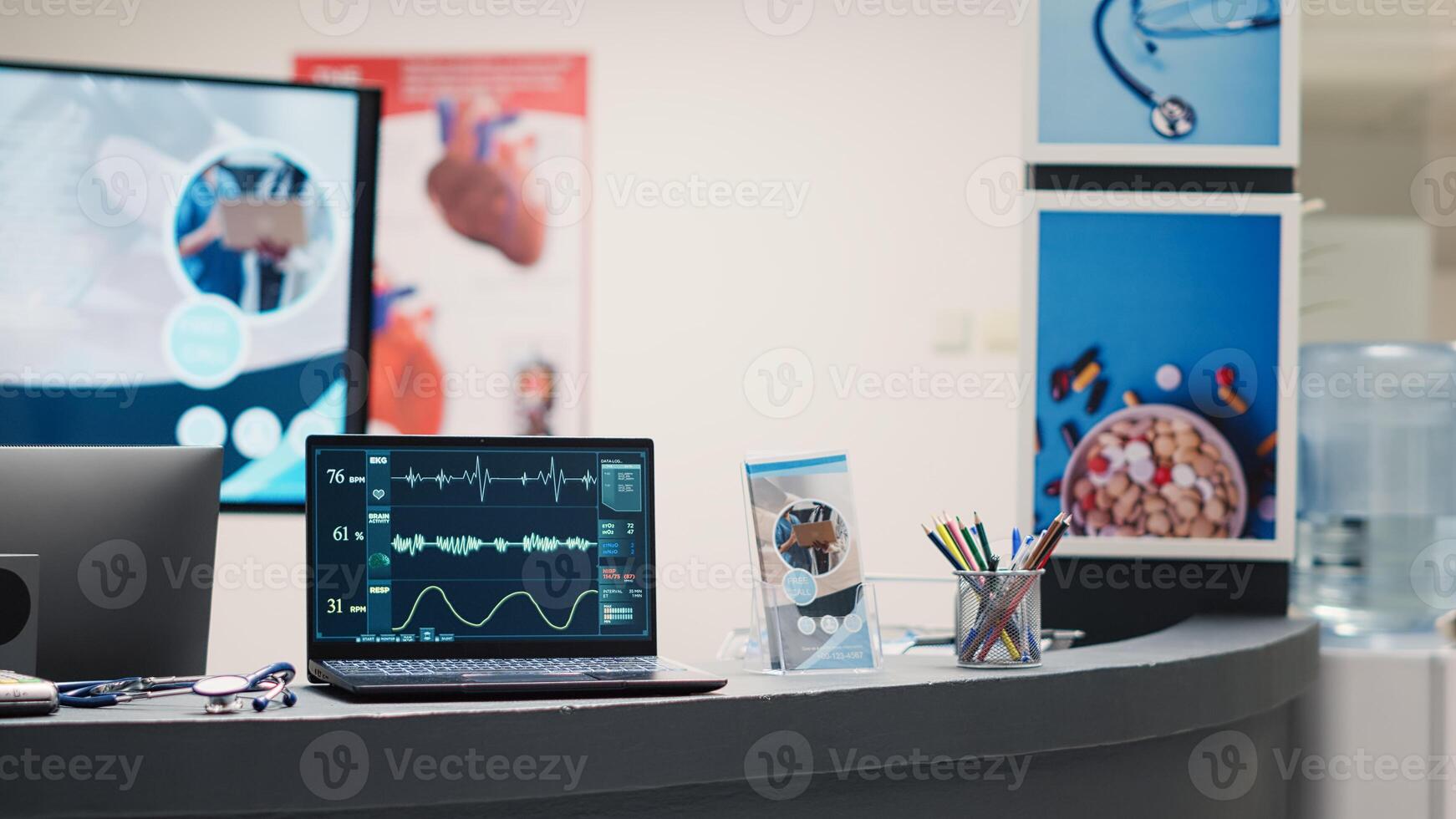 Cardiology diagnosis on laptop at desk, showing cardiogram and heart rate in empty medical facility waiting area. Electrocardiogram analysis and heartbeat pressure on display in lobby. photo