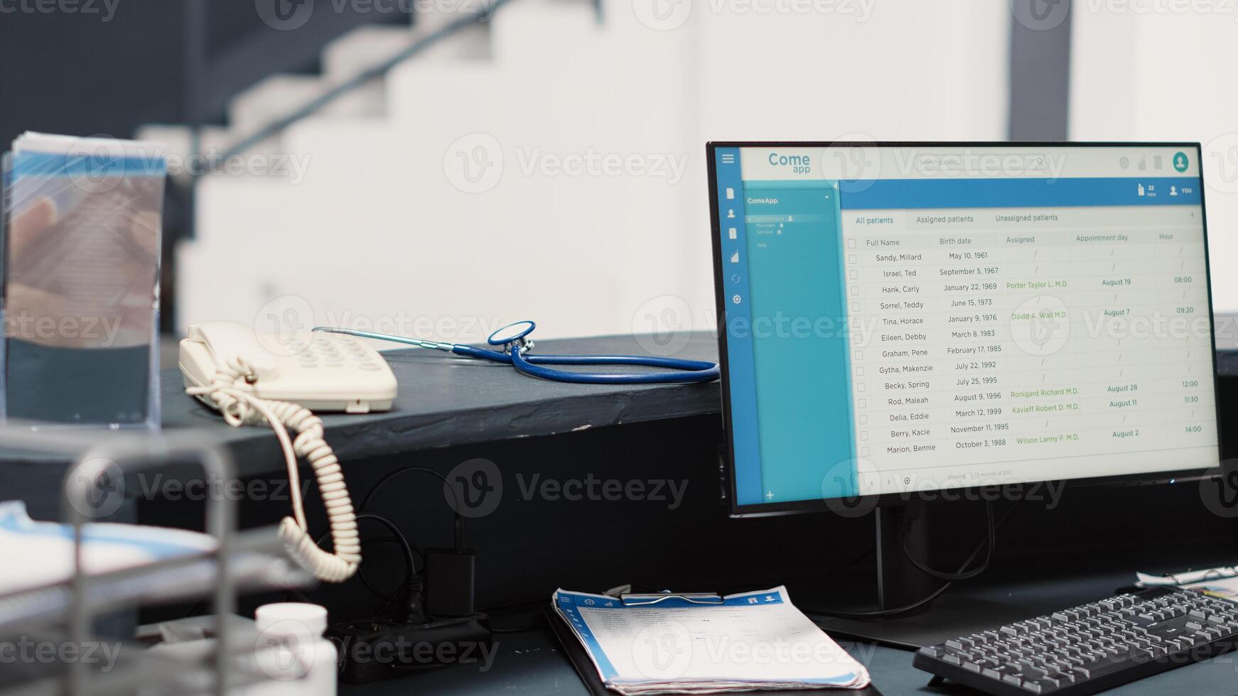 Empty front desk with appointments list on computer, hospital reception counter in medical healthcare facility. Registration forms on papers and monitor, checkup visit consultation. photo