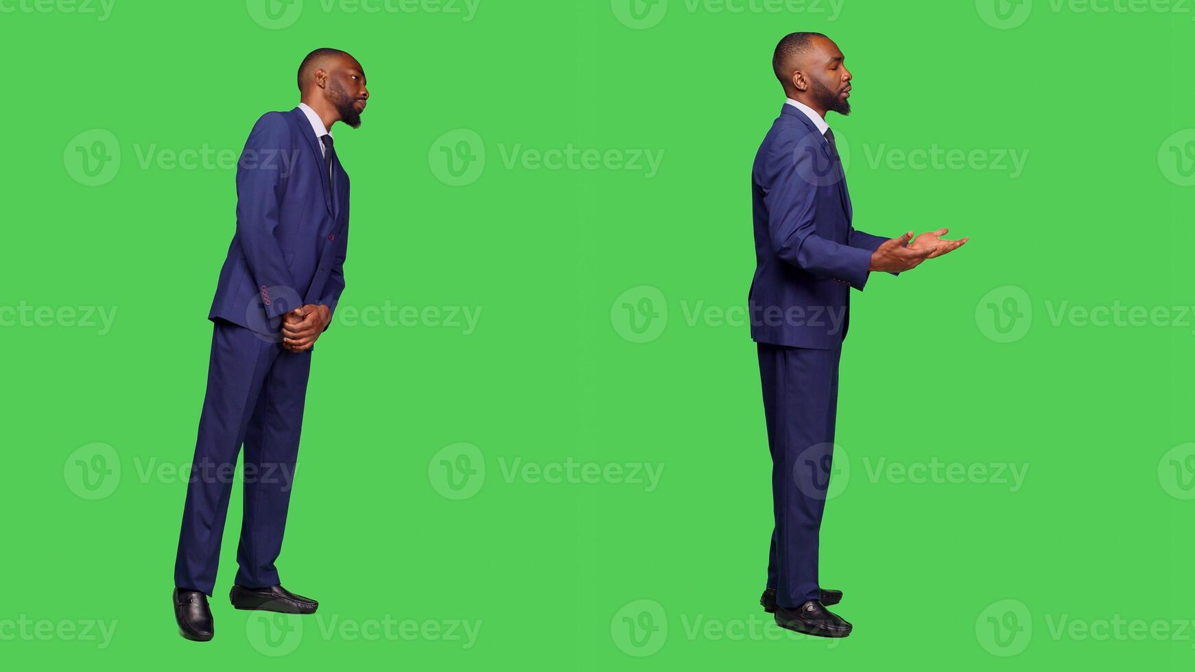 Male office worker in formal suit waiting in studio, looking around over full body green screen. Startup employee feeling confident and stylish on camera, greenscreen background. photo