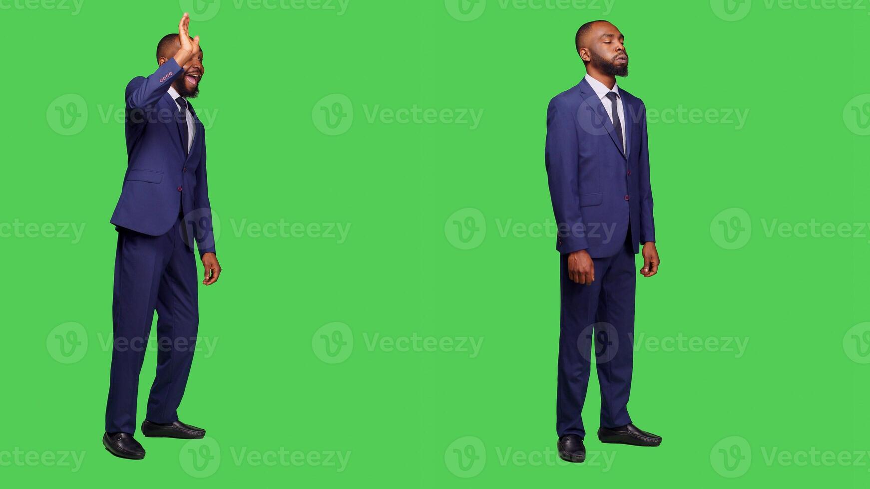 Businessman in suit greeting people and waving, saying hello or goodbye in studio over greenscreen. Male startup employee feeling confident on camera posing, full body backdrop. photo