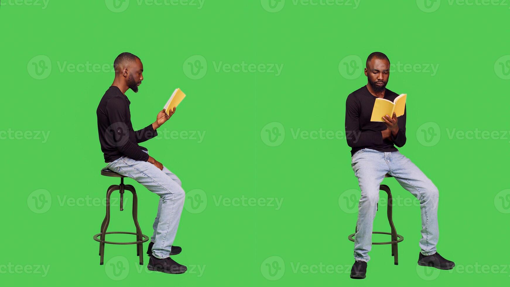 Focused person reading story tale book in studio, sitting on chair over full body greenscreen. Young optimistic man enjoying novel lecture on camera, leisure activity with literature. photo