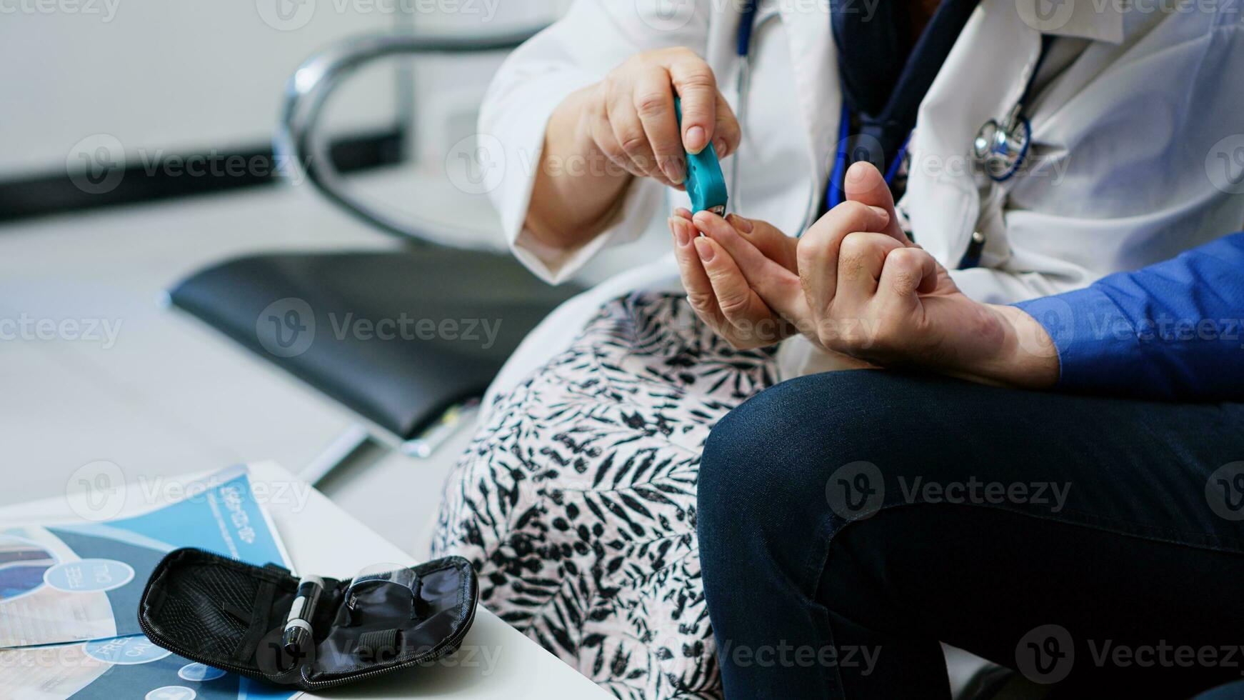 Elderly medic taking insulin level test using glucometer in hospital reception, doing diabetes examination to measure glucose from patient blood sample. Senior man having checkup visit appointment photo