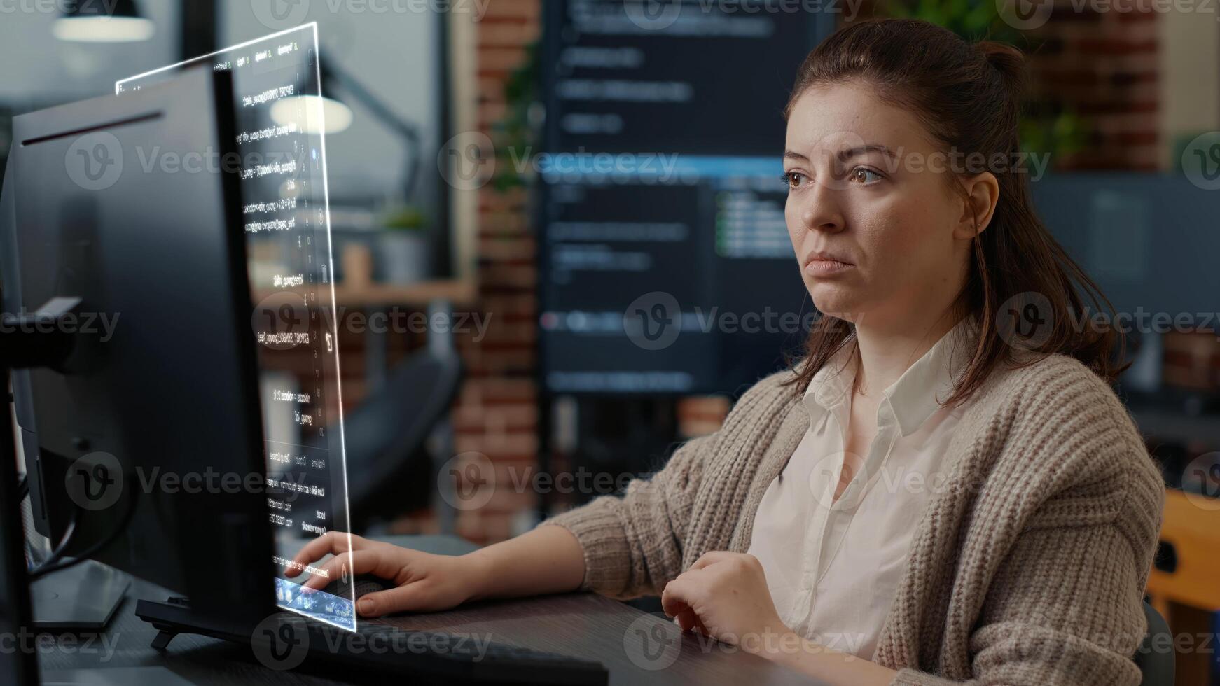 Qualified programmer helped by AR technology to visualize script, writing code on computer screen while in workplace using Java programming languages. Certified engineer solving errors photo