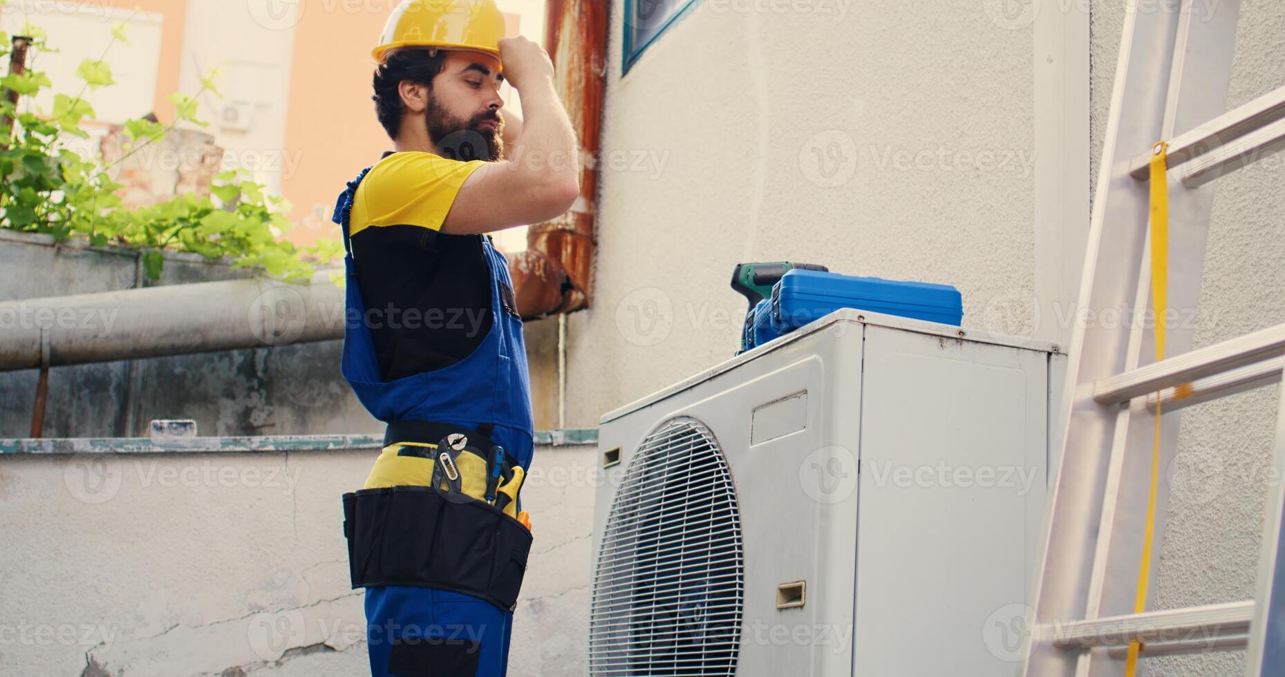 Knowleadgeable engineer arriving on location to help fix system electrical issues caused by improper wiring or broken capacitor requiring professional intervention to diagnose and repair photo