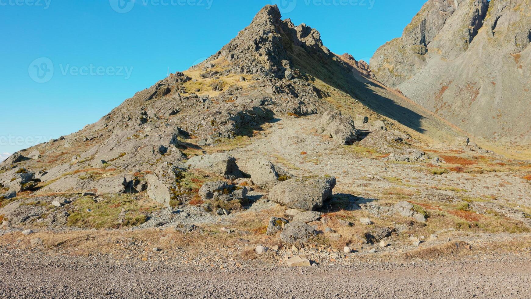 Massive nordic vestrahorn mountain chain on stokksnes peninsula, icelandic landscapes. Beautiful black sand beach in arctic iceland, panoramic view of scandinavian nordic nature. photo
