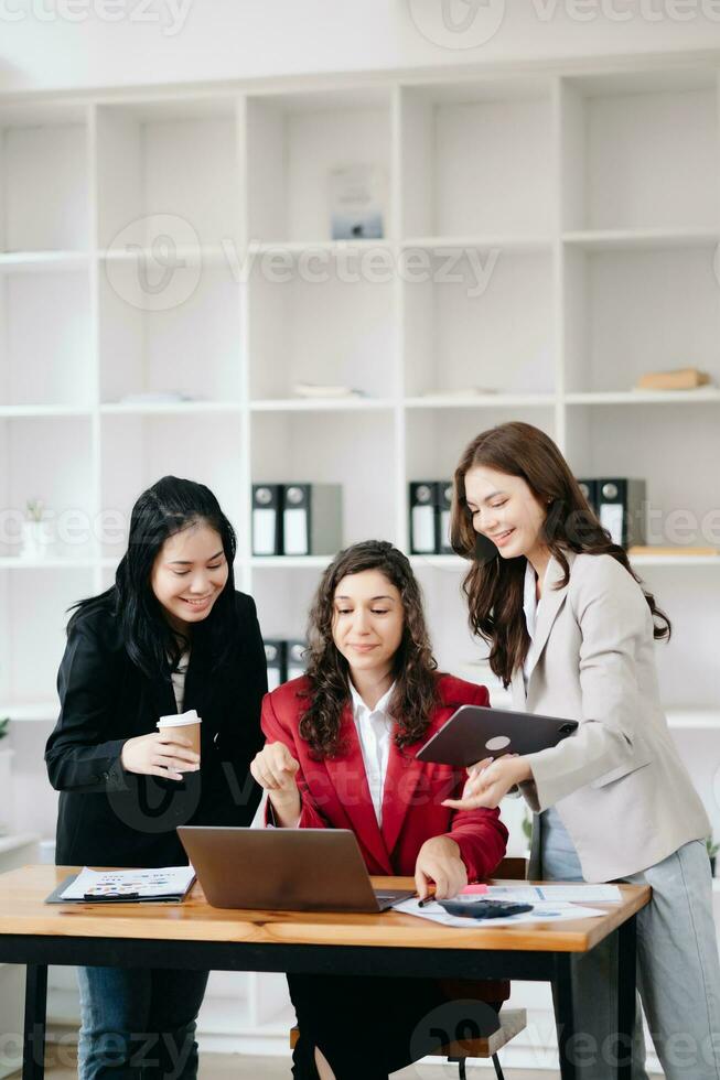 Office colleagues have a casual discussion. During a meeting in a conference room, a group of business teem sit in the conference room new startup project photo