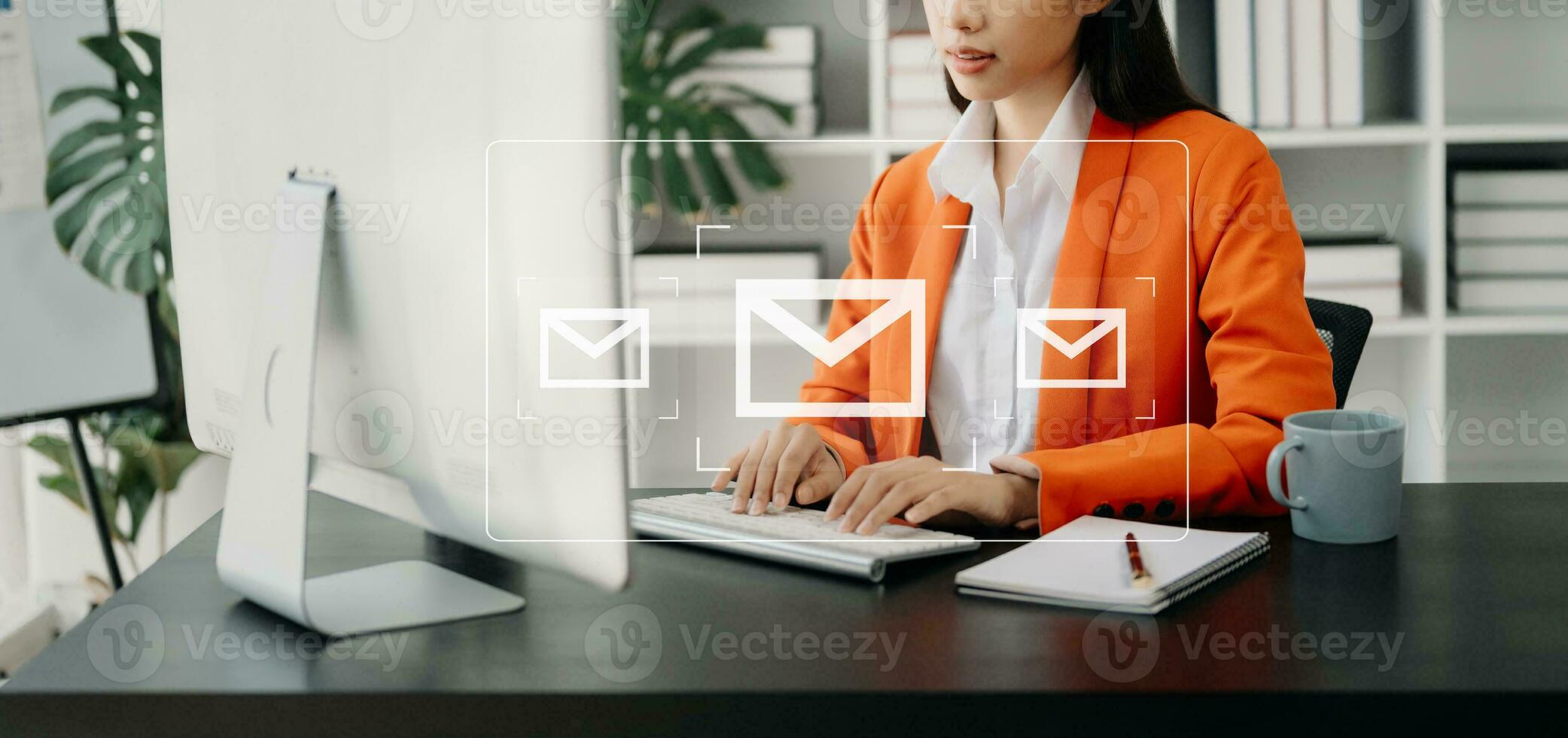 Woman hands using Laptop, tablet typing on keyboard and surfing the internet with email icon, email marketing concept, send e-mail or newsletter, online working internet network technology. photo