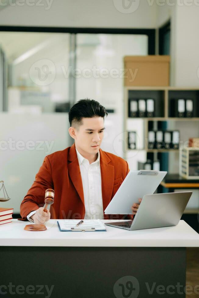 justice and law concept.Male judge in a courtroom on wooden table and Counselor or Male lawyer working in office. photo
