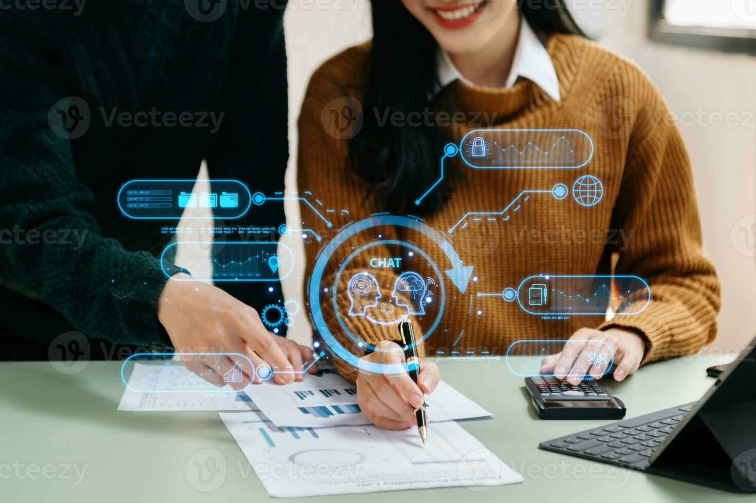 Two woman using chatbot in computer and tablet  smart intelligence Ai.Chat with AI Artificial Intelligence, developed by OpenAI generate. Futuristic technology, robot in online system. photo