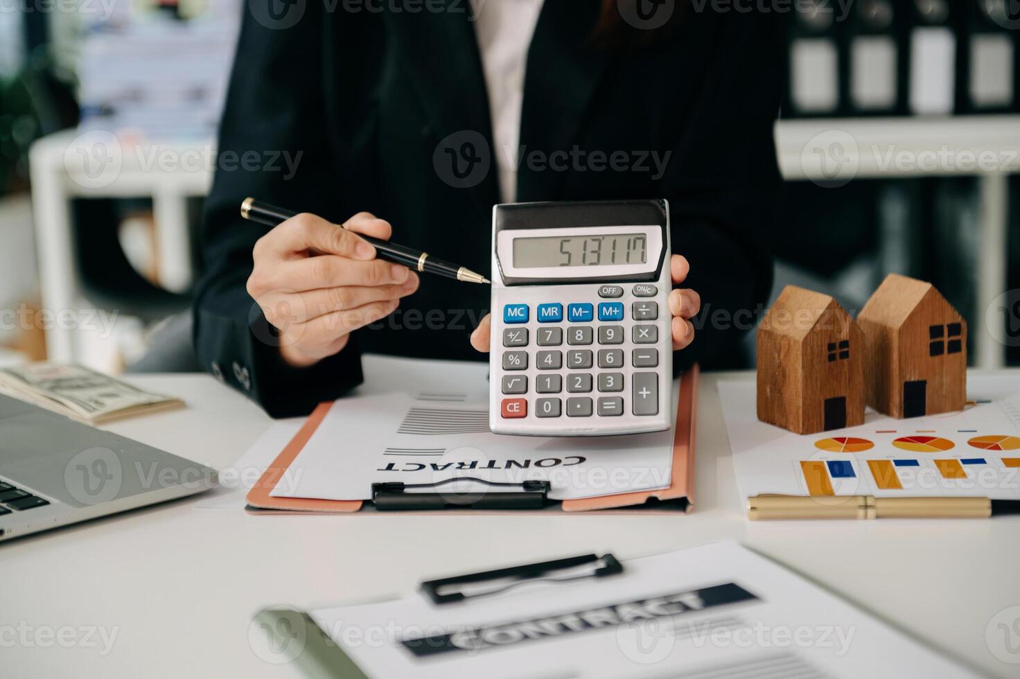 Signing a contract. Client and broker agent, lease agreement, successful deal and  Young business sitting at the desk in office photo