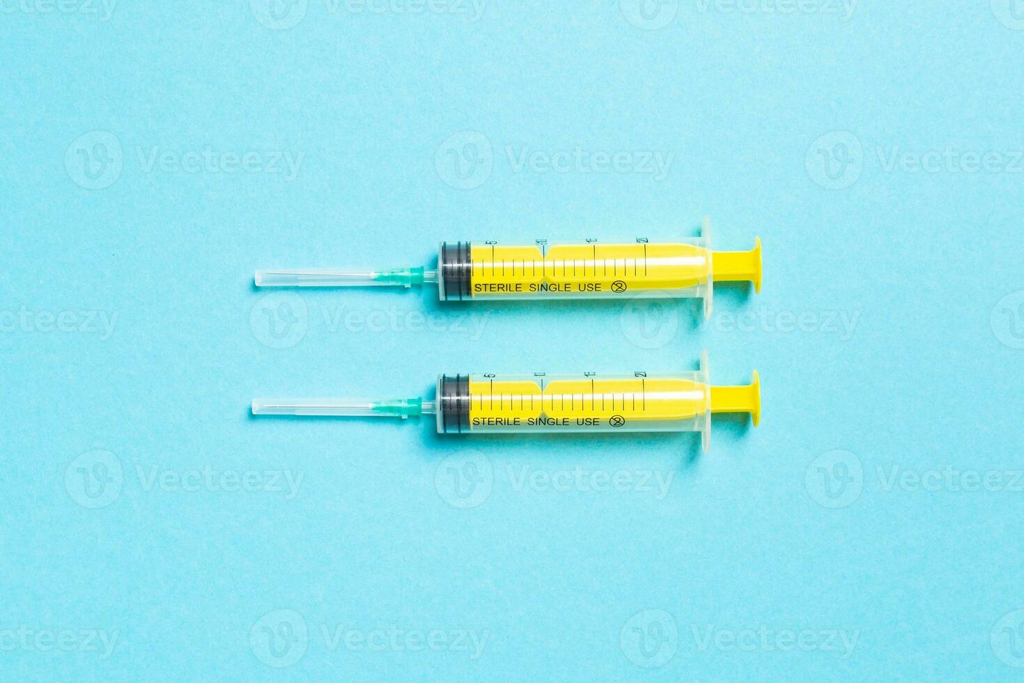 Top view of medical syringes on colorful background. Health care concept with copy space photo