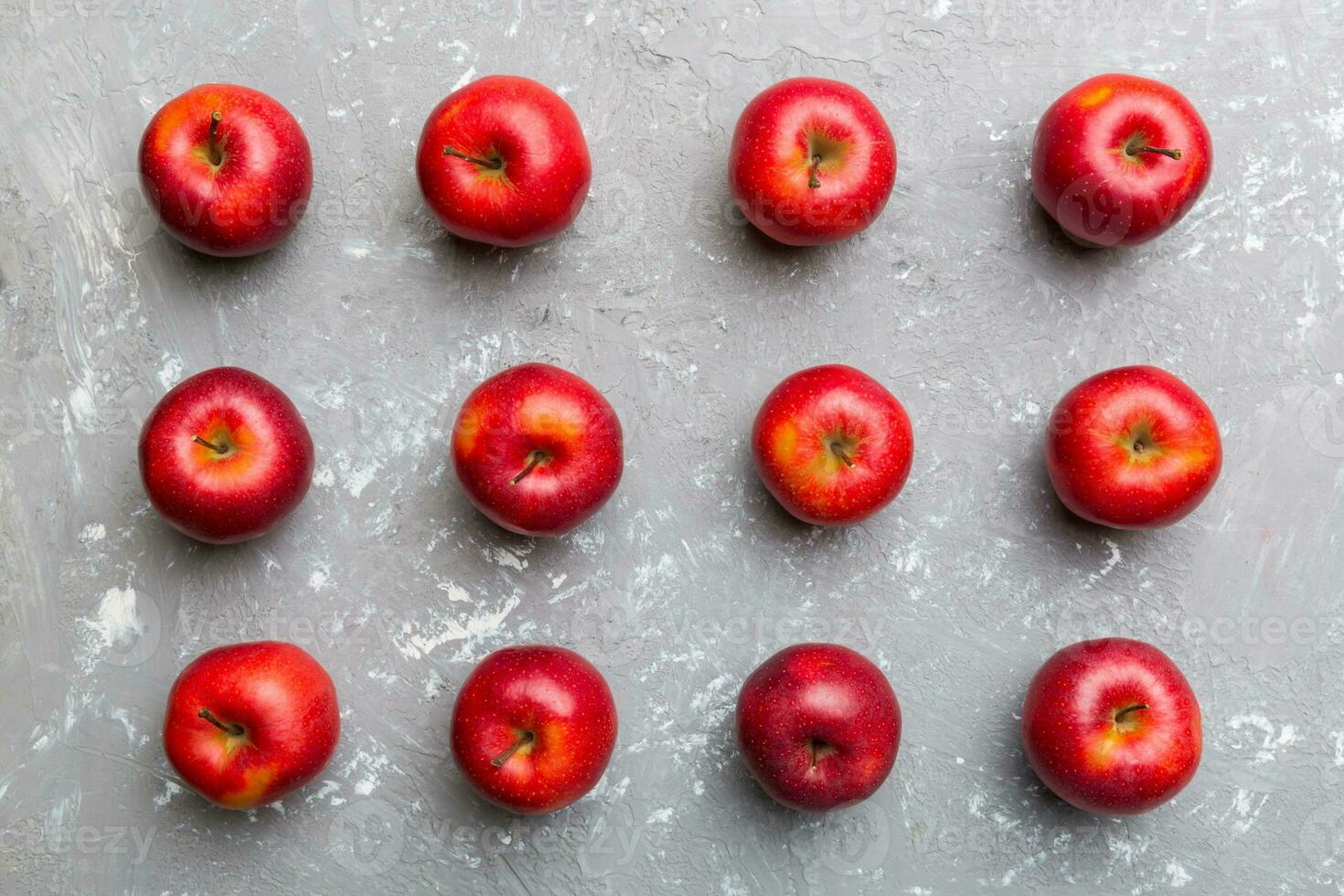 Many red apples on colored background, top view. Autumn pattern with fresh apple above view photo