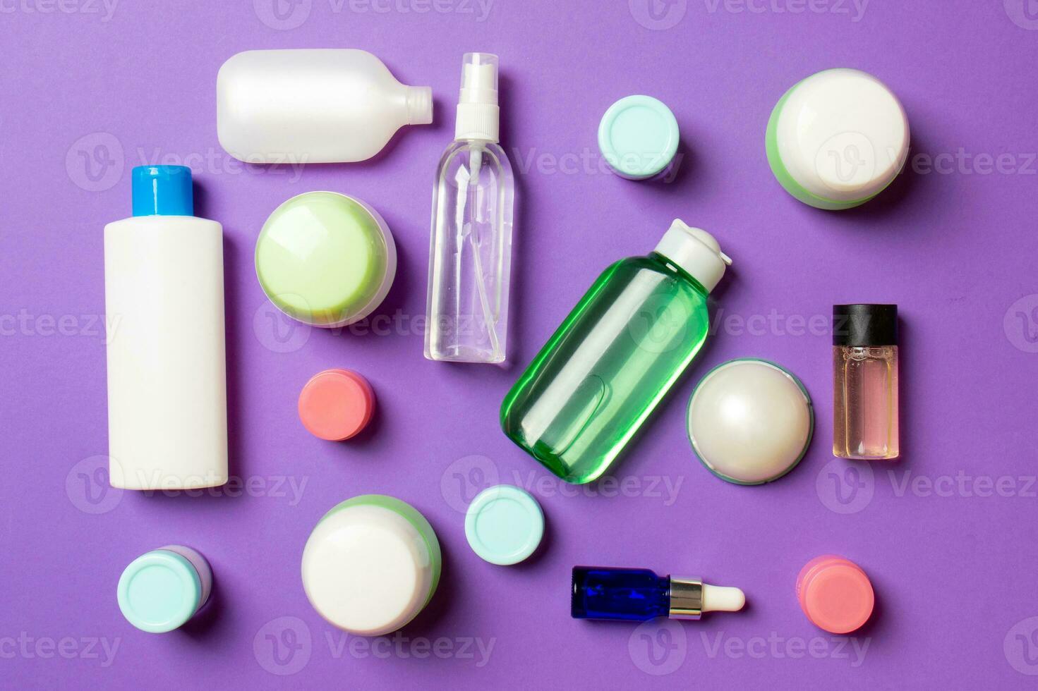 Group of plastic bodycare bottle Flat lay composition with cosmetic products on colored background empty space for you design. Set of White Cosmetic containers, top view with copy space photo