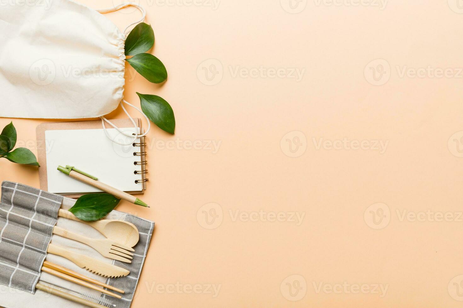 set of empty reusable disposable eco-friendly plates, cups, utensils on light white colored table background. top view. Biodegradable craft dishes. Recycling concept. Close-up photo
