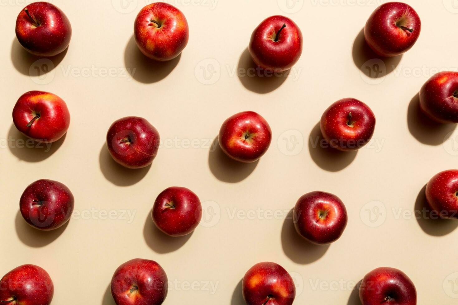 Many red apples on colored background, top view. Autumn pattern with fresh apple above view photo