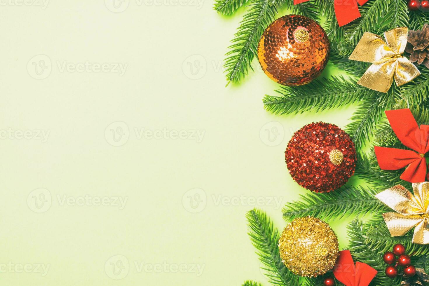 Set of festive balls, fir tree and Christmas decorations on colorful background. Top view of New Year ornament concept with copy space photo