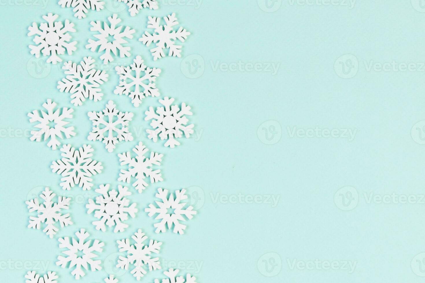 Set of white snowflakes on colorful background. Top view of Christmas ornament. New Year time concept with empty space for your design photo