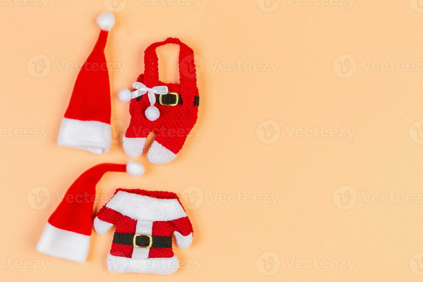 Top view Banner of colorful holiday background made of Santa hats and clothes. Merry Christmas concept with copy space photo