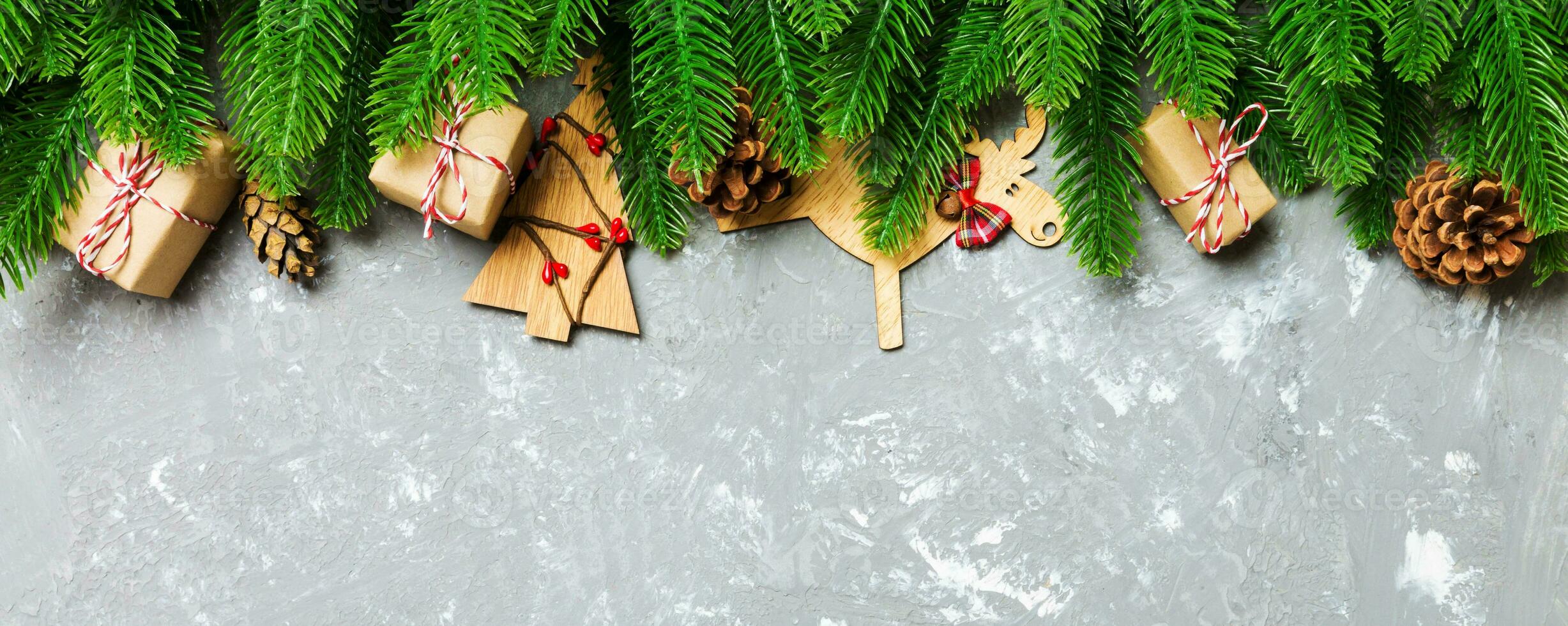 Top view Banner of Christmas background made of fir tree and decorations on cement background. New year holiday concept with copy space photo