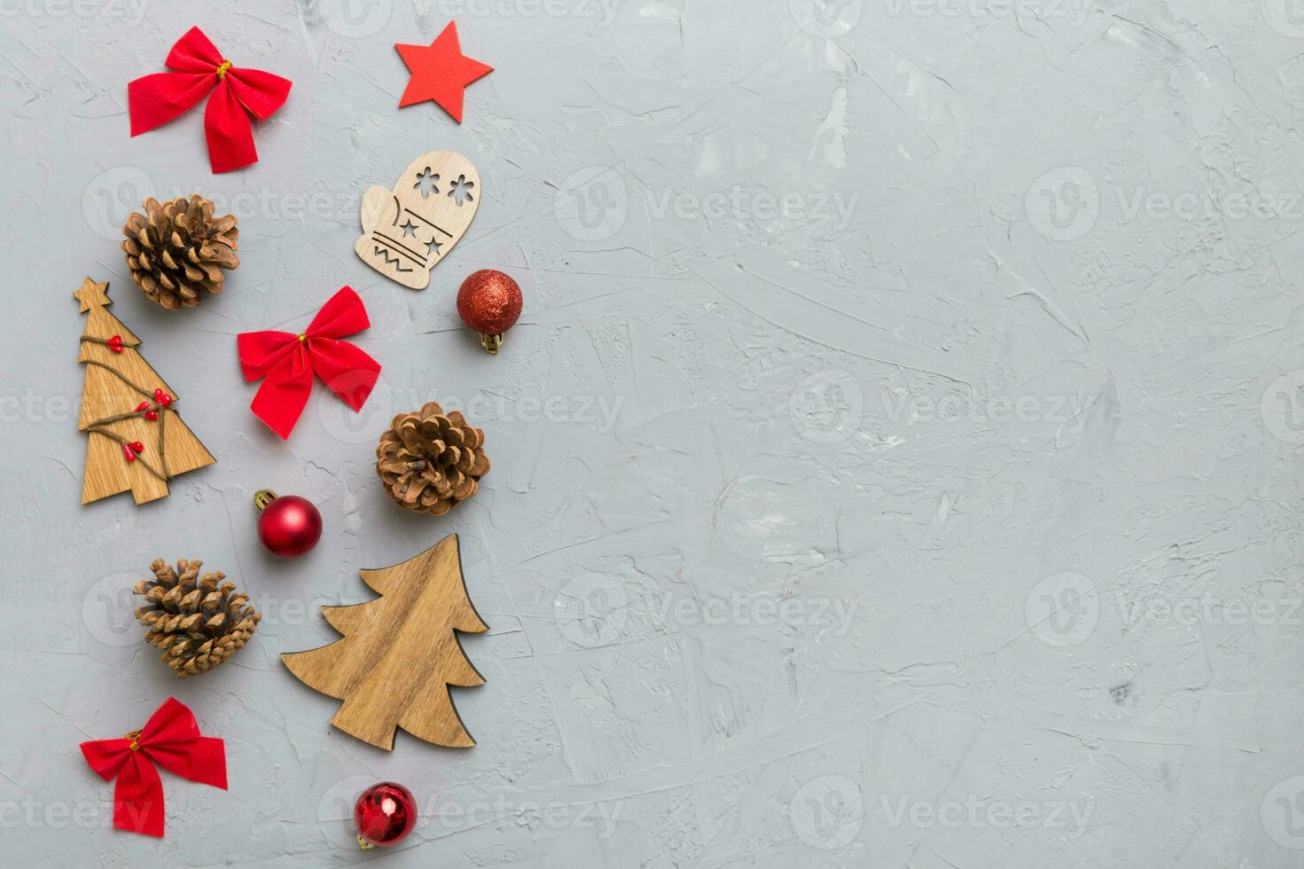 New Year composition. Christmas decor background with pine cones. Top view with copy space photo