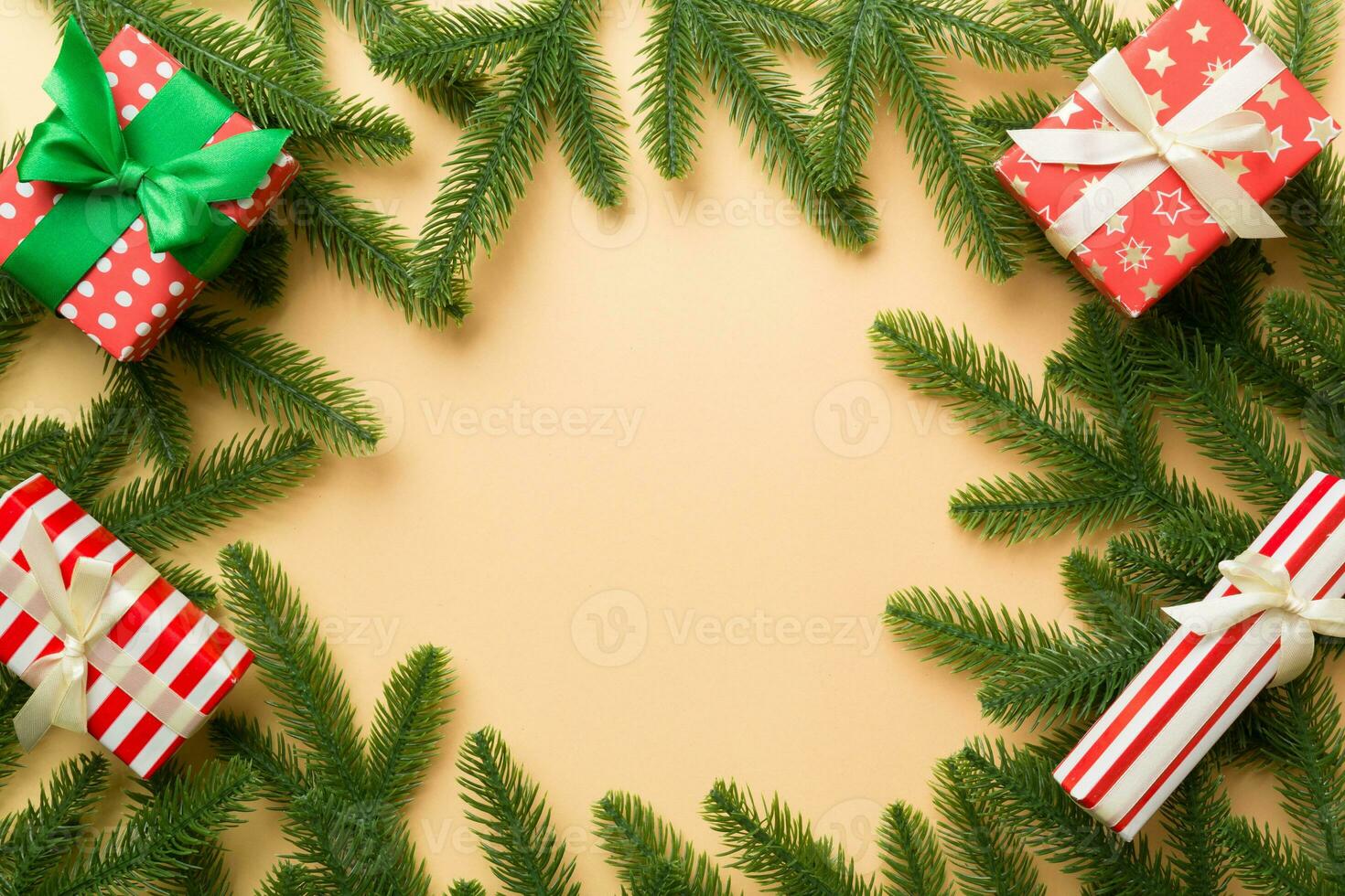 Christmas decorations and fir tree branch and gift boxon dark table. Top view frame with copy space photo