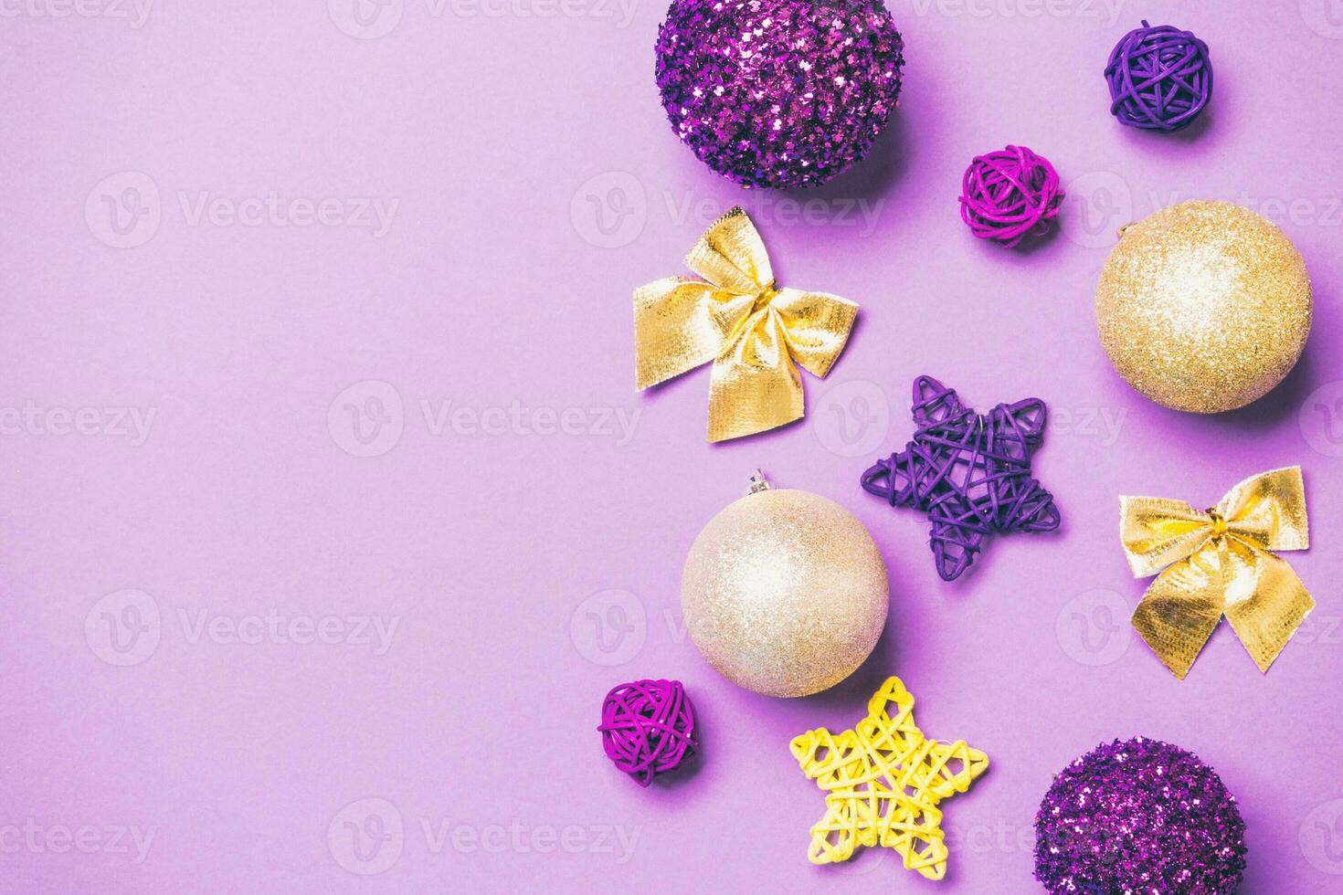 Top view of Christmas balls and creative decorations on colorful background with copy space. New Year concept photo