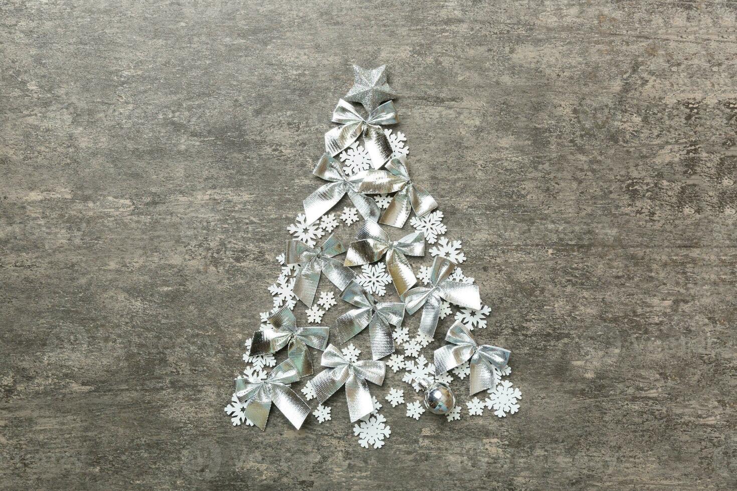 Christmas tree made from colored handmade ball decoration on colored background, view from above. New Year minimal concept with copy space photo
