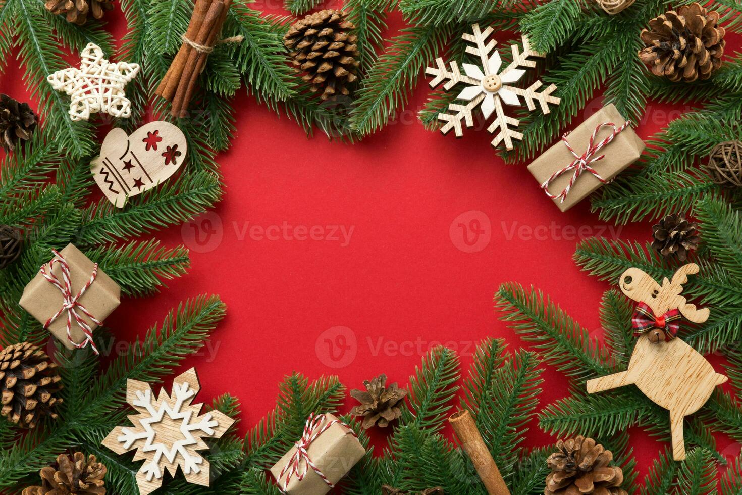 Christmas decorations and fir tree branch and gift boxon dark table. Top view frame with copy space photo