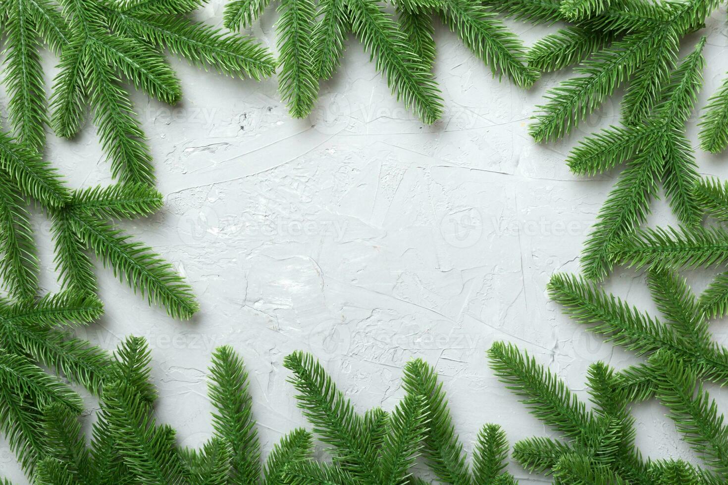 Christmas holiday background with copy space for advertising text. Fir branches on color background . Flat lay, top view photo