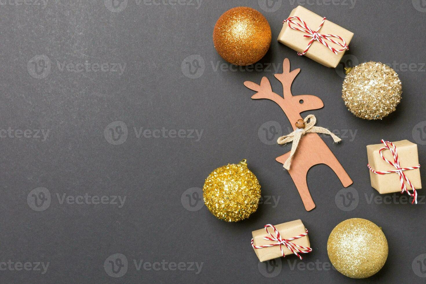 Winter set made of Christmas balls and various decorations on holiday colorful background. Top view of New Year concept with copy space photo