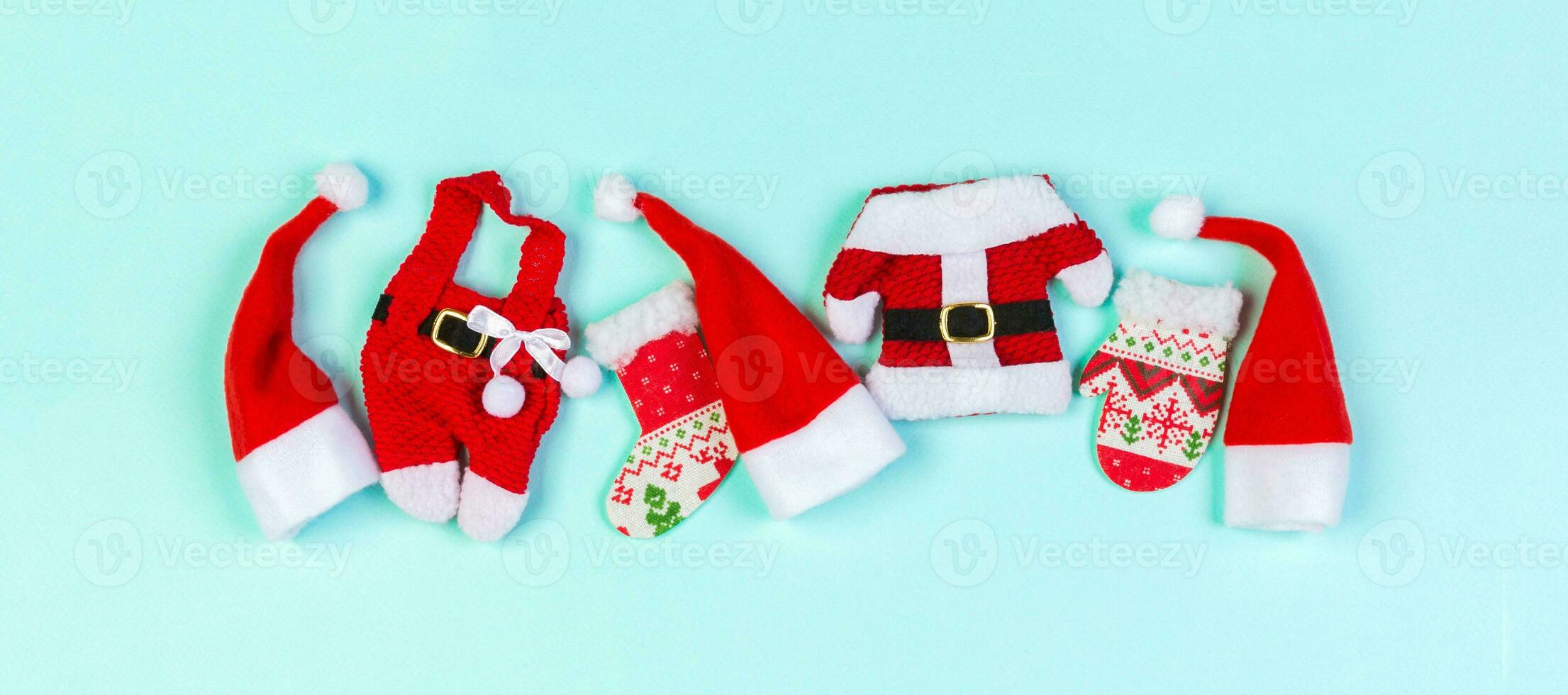 Banner Top view red Santa hats on colorful background. Time for holiday concept with empty space for your design photo